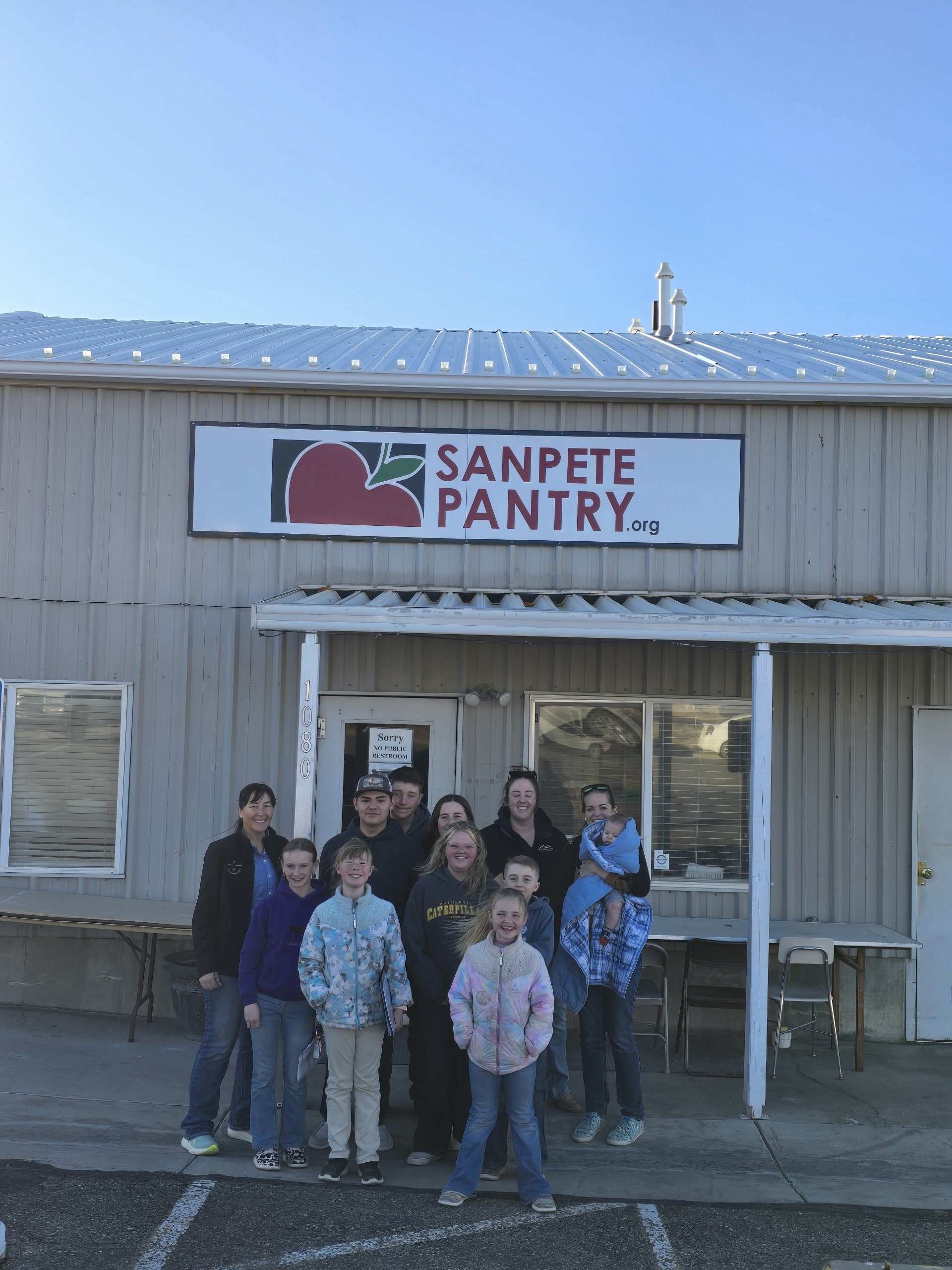 Volunteers in front of pantry